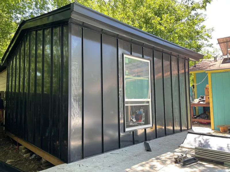 Black standing seam metal wall panels for Metal Roof Installation in River Oaks