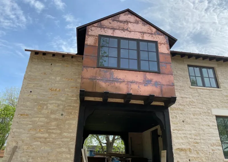 Copper metal panel facade on a stone building for Metal Roof Coating in River Oaks